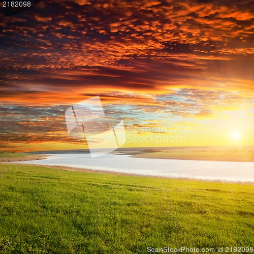 Image of red sunset over river