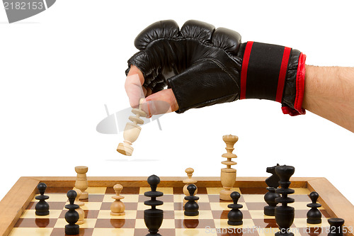 Image of Playing chess in freefight gloves, isolated