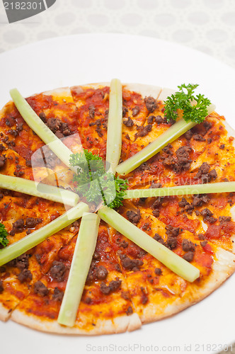 Image of Turkish beef pizza with cucumber on top