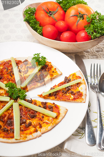 Image of Turkish beef pizza with cucumber on top