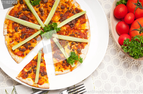 Image of Turkish beef pizza with cucumber on top