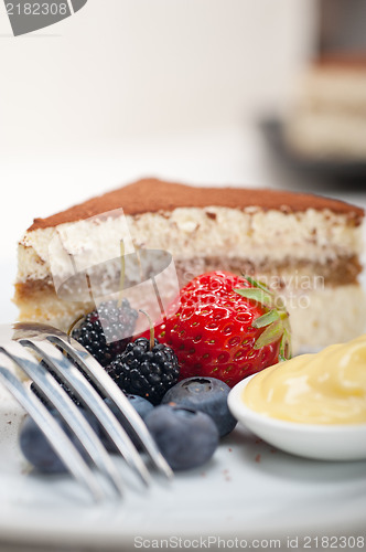 Image of tiramisu dessert with berries and cream