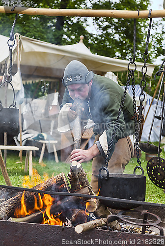Image of Medieval man Making the Fire