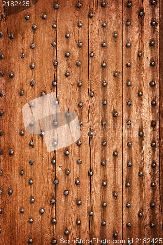 Image of Vintage wooden background with metal rivets