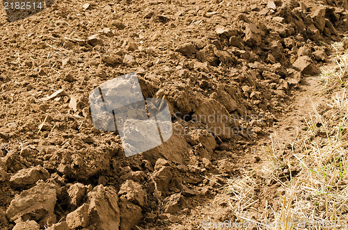 Image of closeup freshly plowed agricultural field soil 