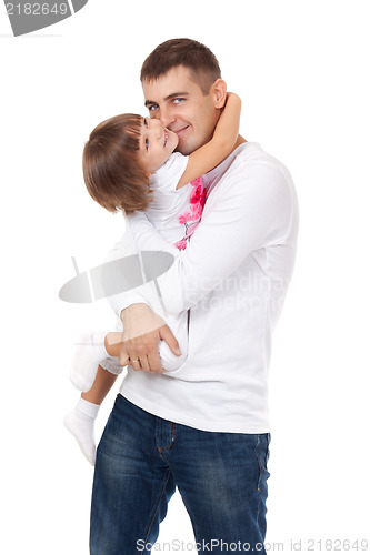 Image of Studio portrait of loving young father hugging his child