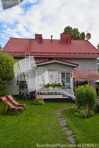 Image of small house with a tiled roof