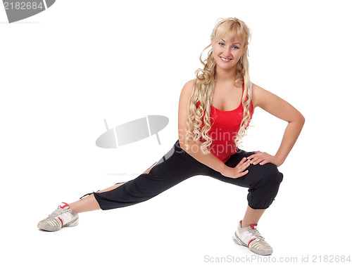 Image of Beautiful young blonde is engaged in fitness, demonstrates the f