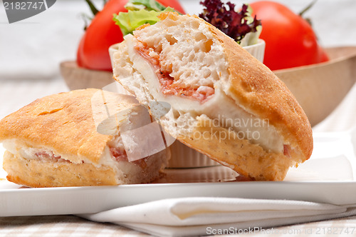 Image of ciabatta panini sandwich with parma ham and tomato