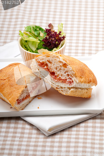 Image of ciabatta panini sandwich with parma ham and tomato