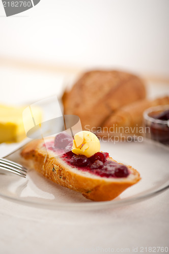 Image of bread butter and jam 