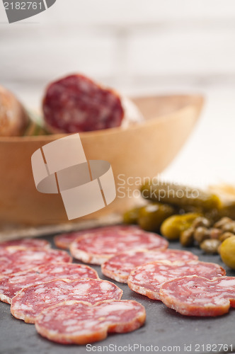 Image of cold cut platter with pita bread and pickles