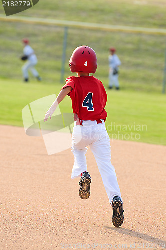 Image of Baseball boy running bases