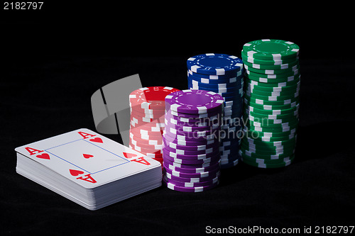 Image of Stacks of Poker Chips with Playing Cards