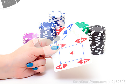 Image of Hand with two Aces and Stacks Poker Chips