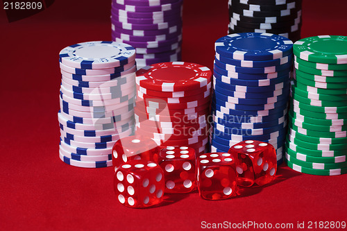 Image of Stacks of Poker Chips with Playing Bones