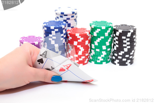 Image of Hand with two Aces and Stacks Poker Chips