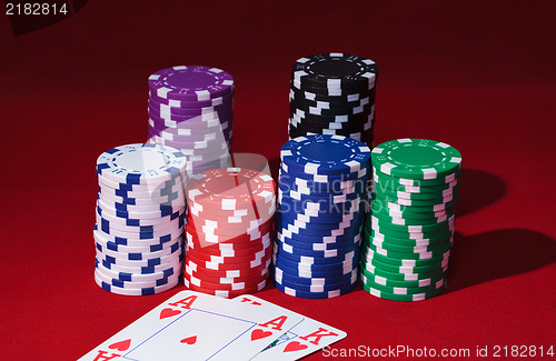 Image of Stacks of Poker Chips with Playing Cards