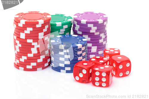 Image of Stacks of Poker Chips with Playing Bones