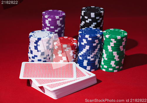 Image of Stacks of Poker Chips with Playing Cards