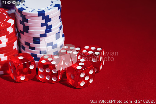 Image of Stacks of Poker Chips with Playing Bones