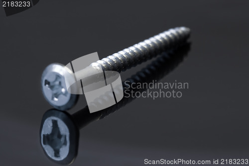 Image of Steel screw on dark background