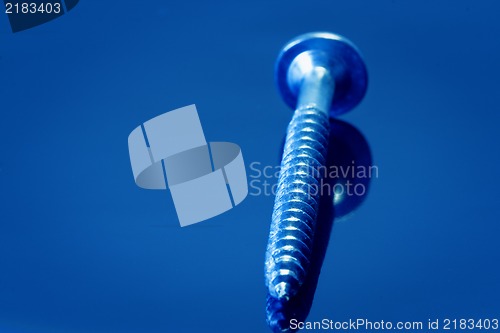 Image of Steel screw on dark  background