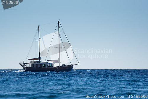 Image of Sail boat sailing on a sunny day