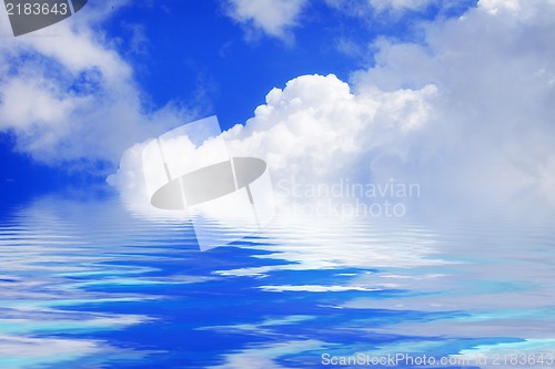 Image of White clouds and blue sky on a sunny day with water reflection