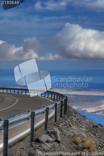 Image of Road on a mountain on a cloudy summer day
