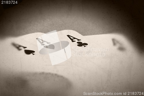 Image of Grunge textured retro style background - Four aces