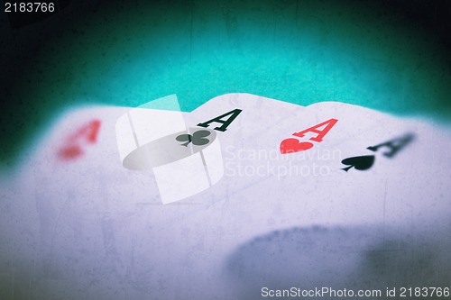 Image of Grunge textured retro style background - Four aces