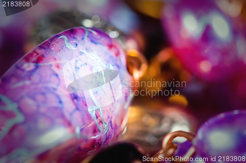 Image of Hand made colorful earrings macro with shallow DOF.