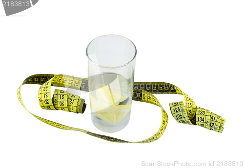 Image of water with lemon in glass and yellow centimeter  