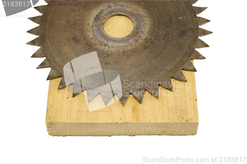 Image of circular saw disk on wood cut board isolated white 