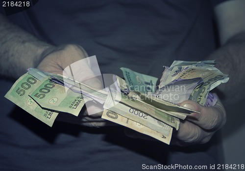 Image of Hands holding money