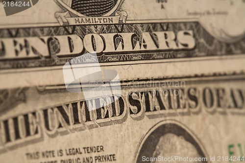 Image of US dollars background, reto style toned photo with shallow DOF