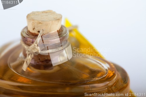 Image of Close up of a perfume bottle on white