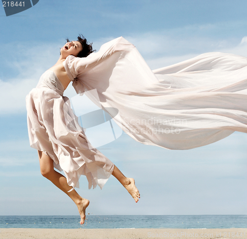 Image of Happy woman on the beach