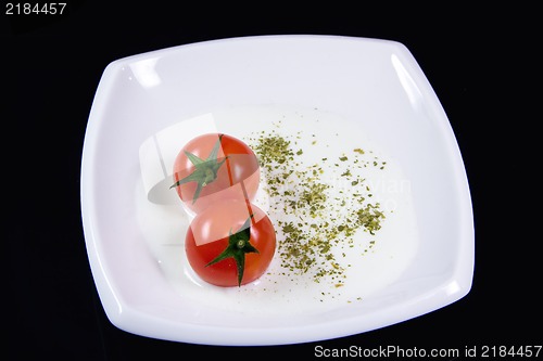 Image of Milky soup with tiny red tomatoes