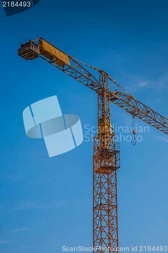 Image of yellow construction crane  on building site