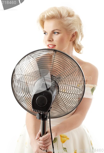 Image of housewife with fan playing pop star