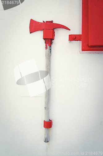 Image of Firefighter axe on the cruiser boat wall