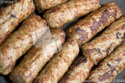 Image of cooking sausages in a pan