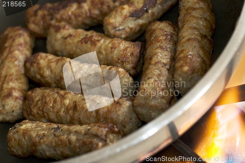 Image of cooking sausages in a pan