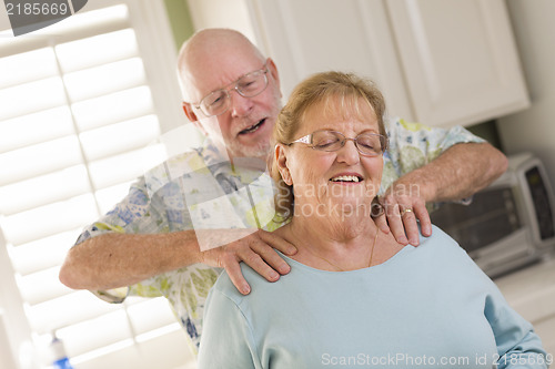 Image of Senior Adult Husband Giving Wife a Shoulder Rub