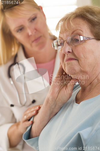 Image of Senior Adult Woman Being Consoled by Female Doctor or Nurse