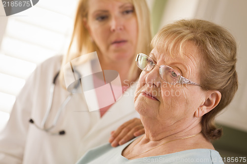 Image of Senior Adult Woman Being Consoled by Female Doctor or Nurse