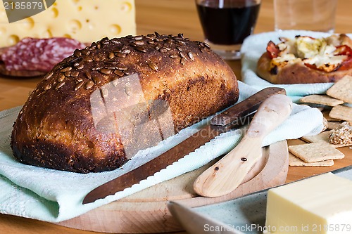 Image of Bread, salami, cheese and wine