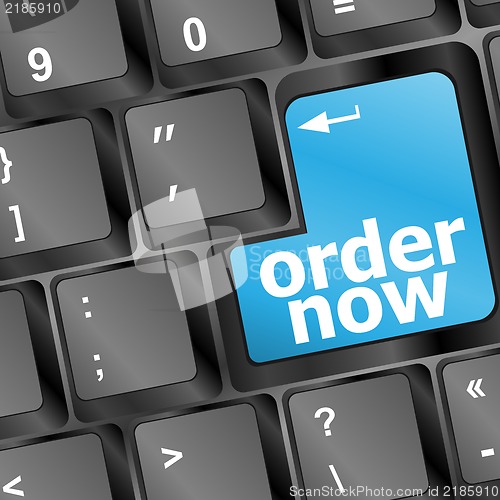 Image of Order now computer key in blue showing online purchases and shopping